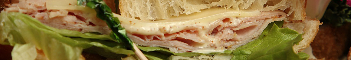 Eating Sandwich at Porterhouse Market restaurant in Eagle, ID.